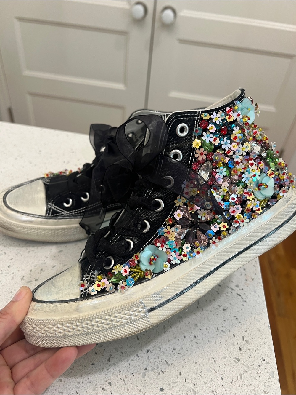 Black High-Top Sneaker with Multicolor Floral Embellishments